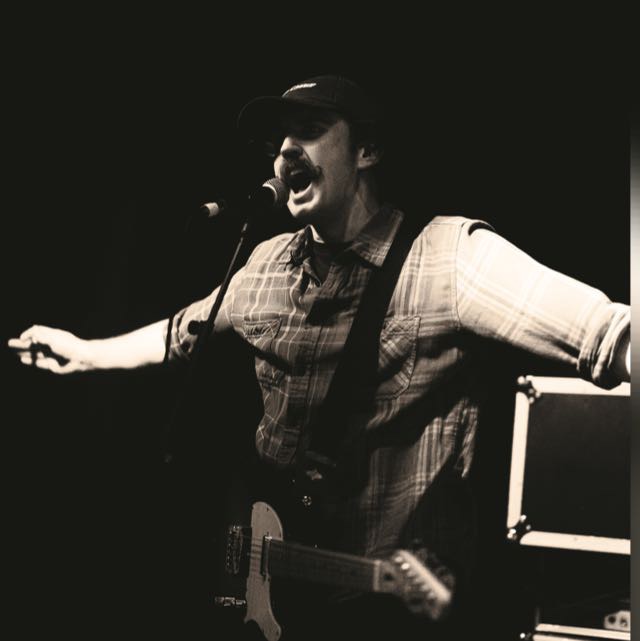 Luke playing live music